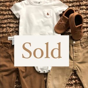 2 pairs of khaki/ tan pants with one white onesie.